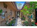 Welcoming entryway with potted plants and decorative elements leading to the front door at 396 Newton, Longwood, FL 32779