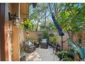 Cozy patio with comfortable seating, hanging plants, and privacy fence at 396 Newton, Longwood, FL 32779