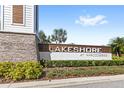 Lakeshore at Narcoossee community entrance sign with lush landscaping and stone accents at 5006 Caspian St, St Cloud, FL 34771