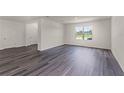 Spacious living room with modern flooring, neutral paint, and views of other rooms at 5217 Marshelder St, Apopka, FL 32712