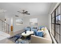 Spacious living room boasting tile floors, natural light, and neutral decor at 6095 Village Cir # 6095, Orlando, FL 32822