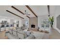 Spacious living room featuring a brick fireplace, vaulted ceilings, and a view of the pool at 702 N Sweetwater Blvd, Longwood, FL 32779