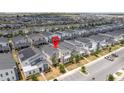 Aerial view of the property in a neighborhood with well-maintained homes, showcasing community layout at 780 Drop Shot Dr, Davenport, FL 33896