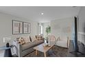 Bright and airy living room with stylish furnishings and decor at 801 Ambleside Dr, Haines City, FL 33844