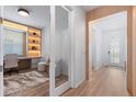 Bright hallway leading to a home office with a built-in desk and shelving at 8105 Fenton St, Orlando, FL 32836