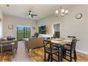 Inviting living room with natural light, modern furnishings, and wood-style flooring at 9055 Treasure Trove Ln # 501, Kissimmee, FL 34747