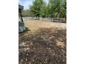 A spacious, partially fenced backyard offering ample space for recreation and outdoor activities at 1238 Lakecrest Dr, Apopka, FL 32703