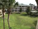 Exterior view of a community with buildings and a large green common area at 133 Oyster Bay Cir # 330, Altamonte Springs, FL 32701