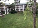 Exterior view of a community with buildings surrounding a large green common area at 133 Oyster Bay Cir # 330, Altamonte Springs, FL 32701