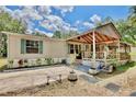 Inviting single-story home with a charming lattice porch and well-manicured landscaping at 18240 Lynbrook Rd, Orlando, FL 32820