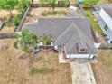 Aerial shot of a single-Gathering home highlighting the backyard's fencing and surrounding neighborhood at 2317 Clearwater Dr, Deltona, FL 32738