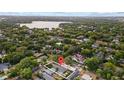 An aerial view of the home in a desirable neighborhood near a beautiful lake and lush green spaces at 2602 Winter Park Rd, Winter Park, FL 32789