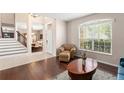 Welcoming foyer featuring hardwood floors, staircase, and natural light at 2644 Slagrove Ct, Winter Garden, FL 34787