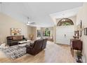 Cozy living area featuring tile floors, vaulted ceilings, and natural light at 324 Old Mill Rd, Enterprise, FL 32725