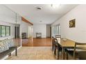 Open-concept living space featuring tile and hardwood floors, natural light, and neutral décor at 4021 Hargill Dr, Orlando, FL 32806