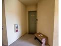 Condo entrance, door number 419 with a bench at 419 Terrace Ridge Cir # 419, Davenport, FL 33896