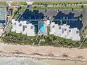 Aerial view showcasing the condo's beachfront location and community pool at 5301 S Atlantic Ave # 51, New Smyrna Beach, FL 32169