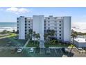 Stylish oceanfront condo building with lush landscaping and ample parking at 5301 S Atlantic Ave # 51, New Smyrna Beach, FL 32169