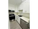 Well-appointed kitchen with stainless steel appliances and ample counter space at 6328 Raleigh St # 816, Orlando, FL 32835