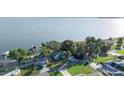 Lakefront homes with private docks and lush landscaping, offering stunning waterfront living at 7046 Treasure Island Rd, Leesburg, FL 34788