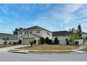 Corner lot residence shows the spacious front yard and driveway and lush landscaping at 7407 Country Run Pkwy, Orlando, FL 32818