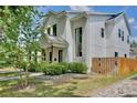 Contemporary home with stone accents, lush landscaping, and a mix of modern and classic architectural elements at 833 Dartmouth St, Orlando, FL 32804