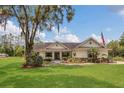 Inviting single-story home featuring a spacious front lawn and mature trees at 10528 Old Dade City Rd, Lakeland, FL 33810