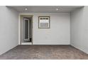 The townhome entryway features a brick floor and a large, bright window at 14259 Kellogg Ave, Orlando, FL 32827