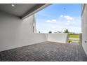 The townhome features a brick patio with ample sunlight and view at 14259 Kellogg Ave, Orlando, FL 32827