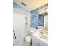 Bathroom with a tile shower, modern fixtures, and a vanity at 1603 Gaston Foster Rd, Orlando, FL 32812