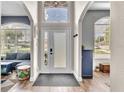 Inviting entryway featuring arched doorways and a transom window above the front door at 1610 River Birch Ave, Oviedo, FL 32765