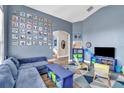 Spacious living room with a large sectional sofa, modern decor, and an archway entrance at 1610 River Birch Ave, Oviedo, FL 32765