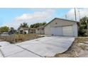 Single-story home with an attached garage and a concrete driveway at 1828 Matterhorn Dr, Orlando, FL 32818