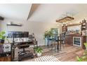 Stylish living room featuring a home bar area with custom wooden bar and shelving, seating, and modern flooring at 2098 Carpathian Dr, Apopka, FL 32712