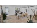 Bright living room with hardwood floors, barn door, and stylish decor at 245 W George Ave, Maitland, FL 32751
