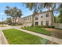 Two-story home in a neighborhood with a well-maintained lawn and landscaping at 2658 Palmetto Ridge Cir, Apopka, FL 32712