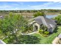Beautiful single-Gathering home with manicured lawn and lush landscaping, near serene lake views at 27127 Stoney Brook Dr, Leesburg, FL 34748