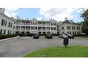 Condo building with convenient parking lot and well-maintained landscaping at 280 Celebration Blvd # 208, Kissimmee, FL 34747