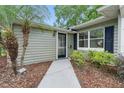 Close-up of the front door of a home with a landscaped yard and a welcoming entrance at 3204 Amherst Ave, Orlando, FL 32804