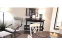 Close up on cozy dining area with table decor, a chair, and a display stand in the corner of a living space at 416 Calabria Ave, Davenport, FL 33897