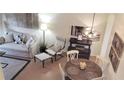Cozy living space featuring a dining area, comfortable seating, and elegant decor, creating a welcoming atmosphere at 416 Calabria Ave, Davenport, FL 33897