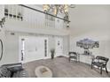 Bright foyer with chandelier, high ceilings and wood flooring at 4262 Lake Underhill Rd # 9C7, Orlando, FL 32803