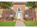 Charming brick townhouse with manicured lawn and mature trees at 4262 Lake Underhill Rd # 9C7, Orlando, FL 32803