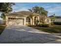Long driveway leading to a well maintained single-story home with a 2-car garage at 4837 Lorraine Way, Orlando, FL 32812