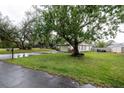 Home with a spacious front yard and driveway, offering great curb appeal and plenty of parking at 789 Barger Dr, Deltona, FL 32738