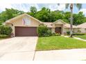 Inviting single-Gathering home with a well-maintained lawn, landscape, and attached garage at 812 Silverwood Dr, Lake Mary, FL 32746
