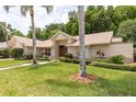 Attractive home featuring a lush green lawn, mature landscaping, and a welcoming facade at 812 Silverwood Dr, Lake Mary, FL 32746