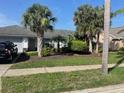Cozy single-story home with mature palms in a well-maintained community at 826 Bright Meadow Dr, Lake Mary, FL 32746
