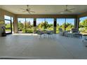 Enclosed outdoor patio with ceiling fans and great view at 871 Iron Oak Way, The Villages, FL 32163