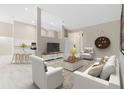 Airy living room featuring sleek furniture, a decorative rug, and an open layout leading to the kitchen at 9885 Montclair Circle Cir, Apopka, FL 32703